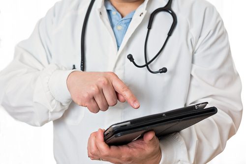 Why EHR Optimization Will be a Dominant Trend over the Next Three Years Physician updating patient chart on a tablet