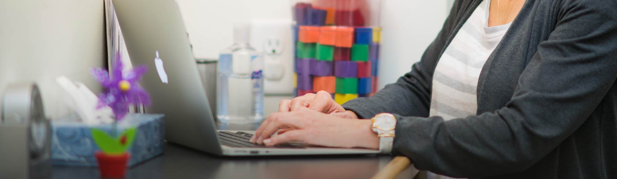 Woman using her laptop in an office setting