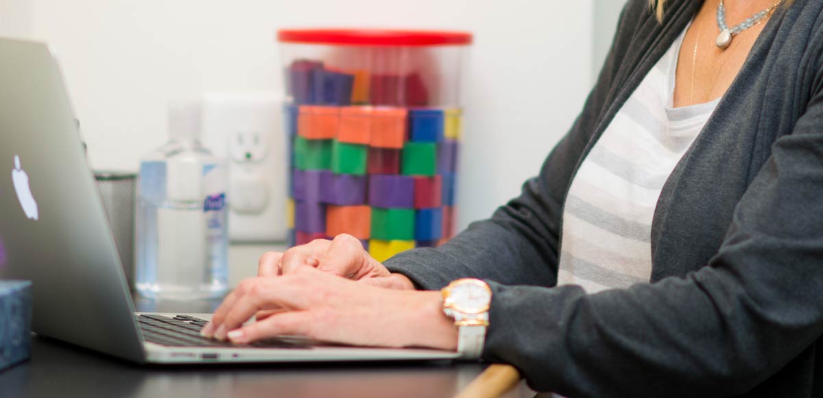 Woman using her laptop in an office setting